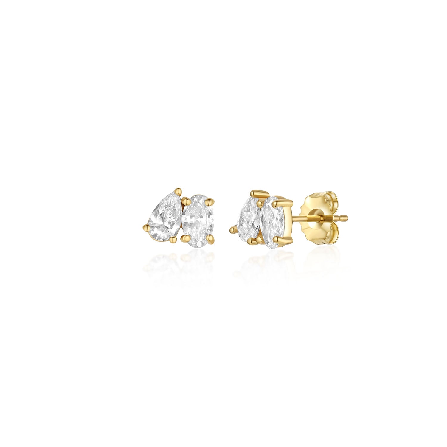 A pair of yellow gold toi et moi style stud earrings with pear and oval diamonds. The earrings are on a white background. the stones are set tilted towards each other and are prong set. 