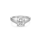 An radiant cut diamond engagement ring in a polished silver-colored metal band, centered on a clean white background. The thick white gold band tapers down from the center stone to the back of the ring.