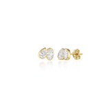 A pair of toi et moi style studs with a pear diamond tilted towards an oval diamond. Bezel set in 14k yellow gold.